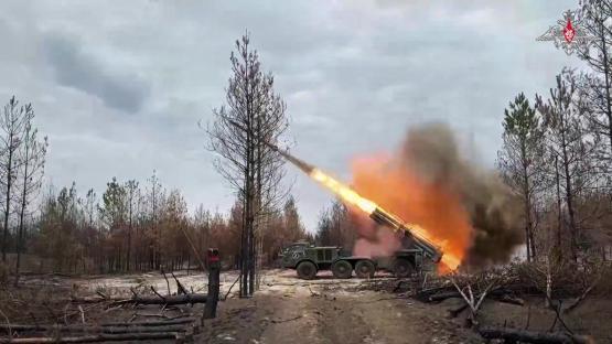 A Russian self-propelled multiple rocket launcher firing towards Ukrainian positions.