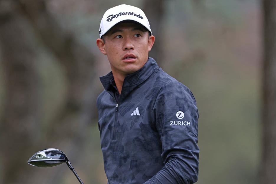 Collin Morikawa of the United States watches his shot from the 12th tee.