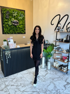 Woman standing in a shop.