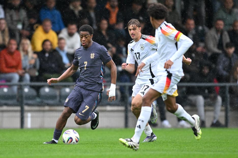 Ryan Kavuma-McQueen of England dribbling the soccer ball during a match.