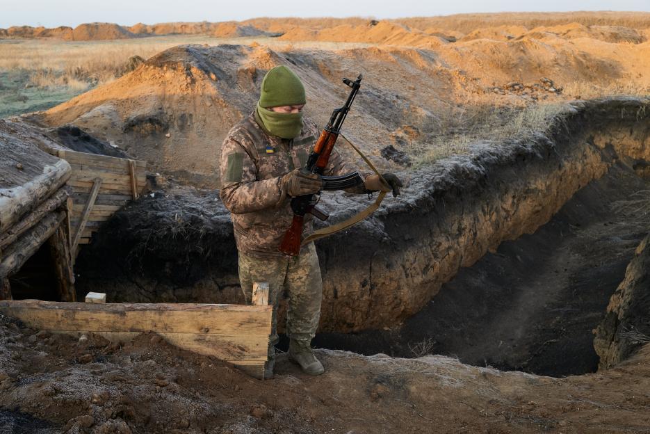 Ukrainian soldier building defensive lines.