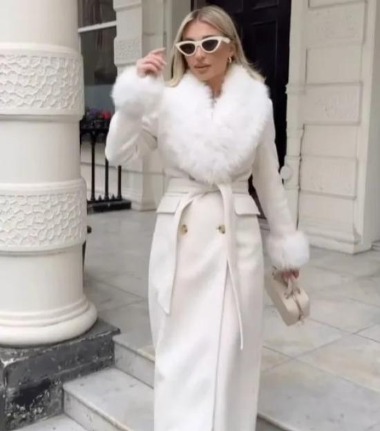 Billie Faiers wearing a white fur-collared coat.
