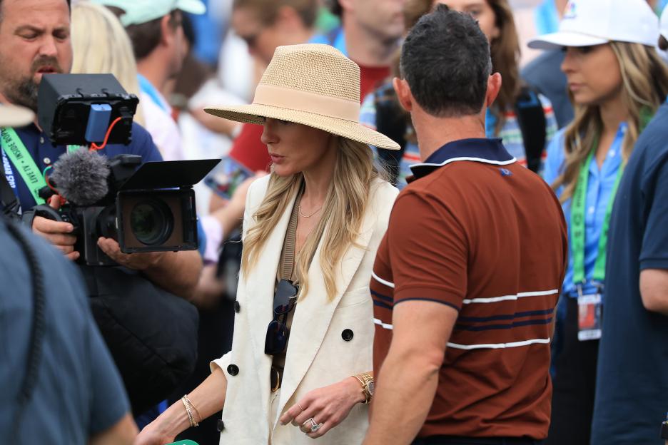 Rory McIlroy and his wife Erica walking at the 2025 Ryder Cup after his win.