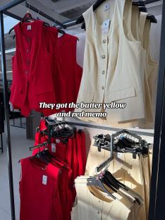 Red and yellow sleeveless tops and coordinating bottoms on display.