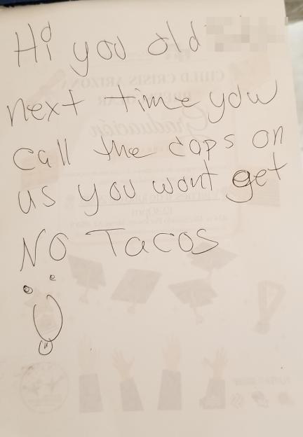 Handwritten note threatening no tacos if the police are called again.