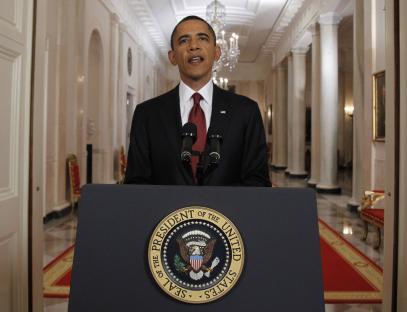 President Barack Obama speaking at a podium in the White House.