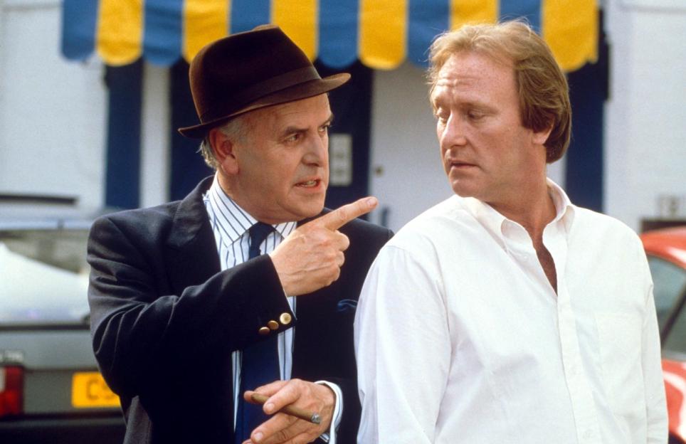 George Cole and Dennis Waterman filming the TV show *Minder*.