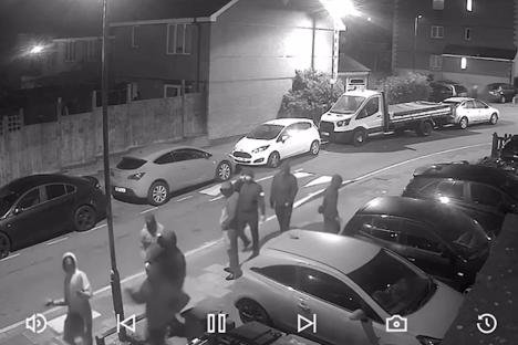 CCTV footage of masked men attacking a home.