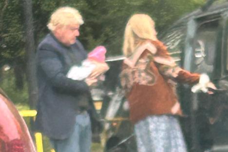 Ex-PM Boris Johnson surprises shoppers at local B&M as he cradles newborn Poppy on trip with wife Carrie