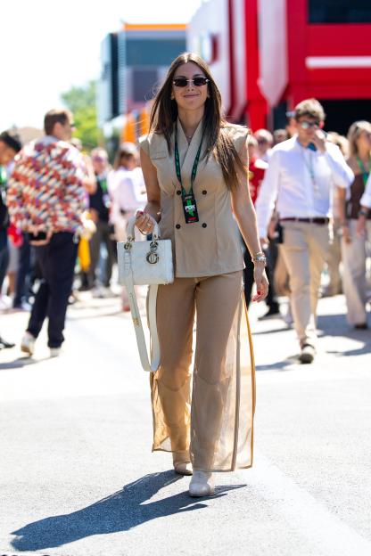 Ferrari Challenge Driver Laura Villars walking in the paddock.