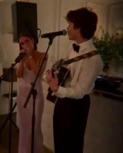 Cruz Beckham and his girlfriend singing and playing guitar.