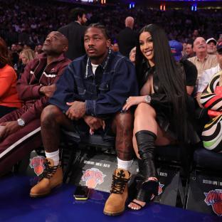 Stefon Diggs and Cardi B at an NBA game.