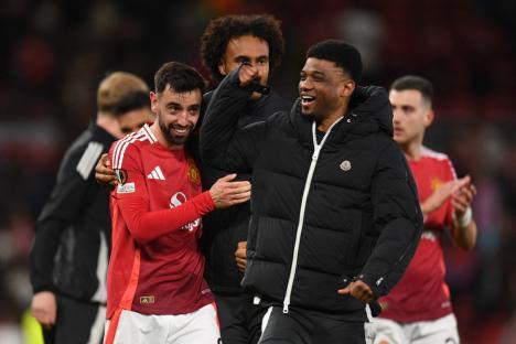 Manchester United's Bruno Fernandes and Amad Diallo celebrating after a football match.