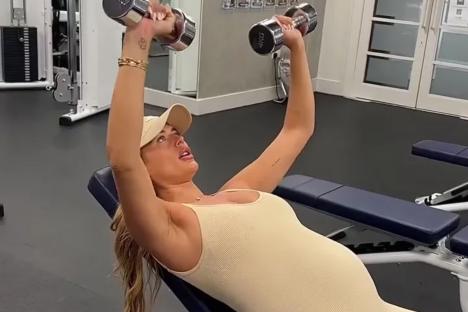 Pregnant Love Island star Arabella Chi shows off huge bump as she lifts weights in the gym ahead of giving birth
