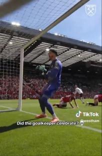 Goalkeeper celebrating after a save.