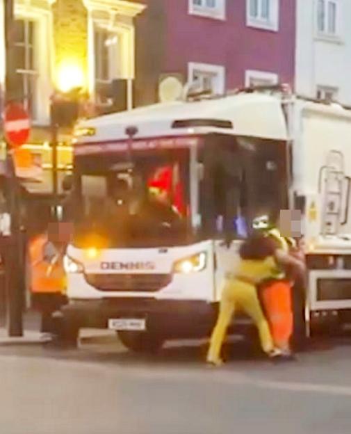 A woman attacking a garbage truck in Camden, London.
