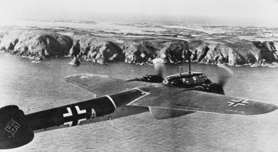(Original Caption) Berlin, Germany: As Nazi Airmen Hammer Away at England. Participating in a raid on England, a Nazi Dornier 215 flies over the island of Guernsey, now in German hands, on the way to the objective. carefully planned raids, intended to