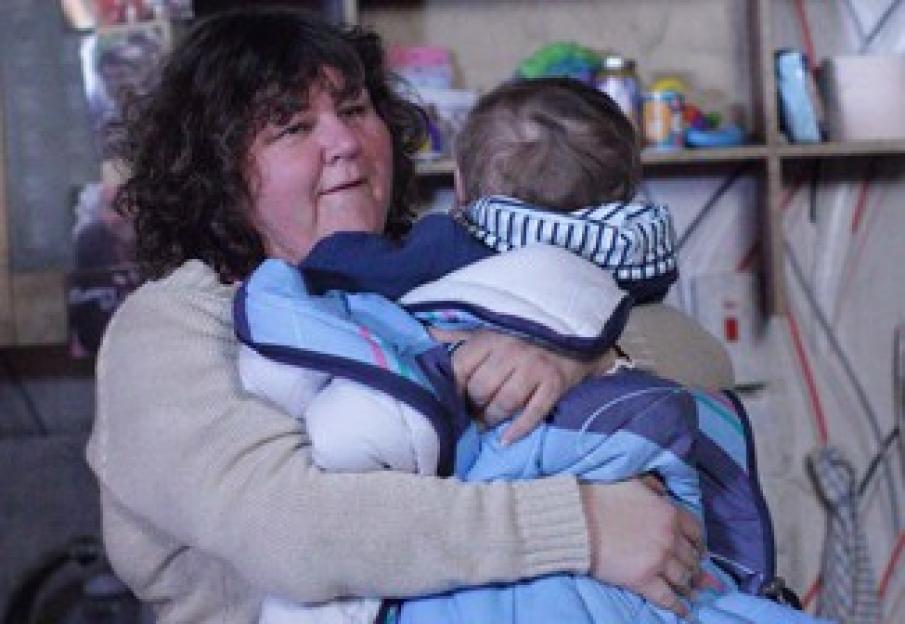© BBC **EMBARGOED FOR PUBLICATION UNTIL TUESDAY 8TH FEBRUARY 2011** Picture shows: Heather Trott (CHERYL FERGISON) and baby George TX: BBC ONE Tuesday 15th February 2011 Heather, exhausted in her freezing bedsit.