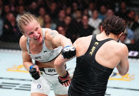 LAS VEGAS, NEVADA - SEPTEMBER 16: (L-R) Valentina Shevchenko of Kyrgyzstan punches Alexa Grasso of Mexico in the UFC flyweight championship fight during the Noche UFC event at T-Mobile Arena on September 16, 2023 in Las Vegas, Nevada. (Photo by Chris Unger/Zuffa LLC via Getty Images)