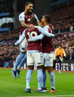 Aston Villa players celebrating a goal.