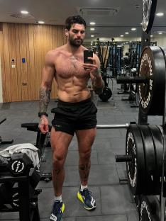 Man taking a selfie in a gym.
