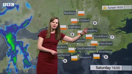 Weather presenter giving Saturday forecast.