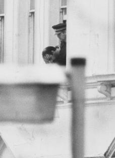 Photo of a police officer escorting a hostage during the Iranian Embassy siege.