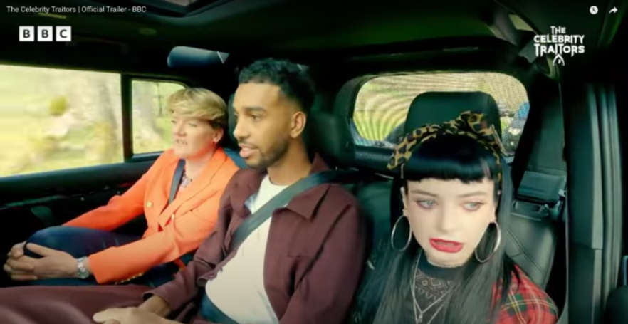 Three people in a car from The Celebrity Traitors.