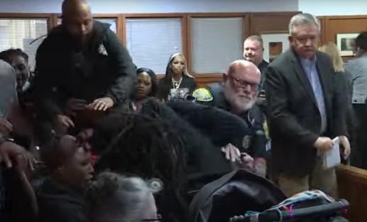 A courtroom brawl breaks out.