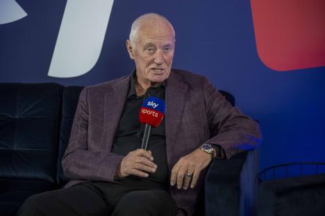 Barry Hearn holding a Sky Sports microphone.