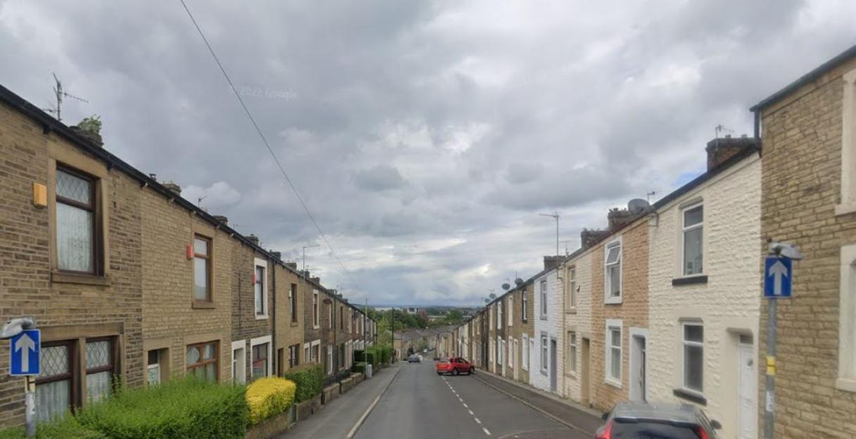View down Belfield Road showing terraced houses.