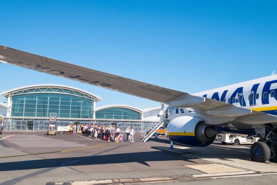Passengers boarding a plane at Bournemouth Airport.