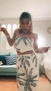 Woman in palm tree print outfit.