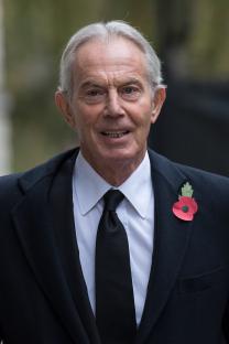 Sir Tony Blair wearing a poppy.