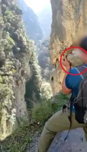 Story from Jam Press (Idiot Throws Rock) Pictured: Video grab - The tourist is seen casting the heavy rock in northern Spain¿s Picos de Europa National Park. VIDEO: Idiot tourist faces ¿168,000 fine for throwing huge rock down gorge in popular park An idiot tourist is facing an eye-watering ¿168,000 fine for throwing a massive rock down a gorge in a popular national park. The young man¿s pal filmed him casting the heavy rock and the video was later uploaded to social media for ¿likes¿. Seconds after the large stone was tossed, a deafening bang was heard as it hit the ground several metres below. The idiotic stunt was filmed at a point along the popular Cares Trail in northern Spain¿s Picos de Europa National Park. Of the park¿s estimated 2m annual visitors, around 300,000 hike the Cares Trail - its most popular walking route. The clip was later shared by a social media account that features videos of young people throwing rocks into voids. Although most clips on the page get a handful of views, this one blew up and quickly caught the police¿s attention. The Spanish Civil Guard have since announced that they are investigating the young man¿s antics, as reported by NeedToKnow. A spokesperson said: ¿This stunt could cost you dearly. ¿Throwing this rock could land this person with a fine ranging from ¿5,001 to ¿200,000. ¿Why? Because disturbing the environment in the Picos de Europa National Park is classed as a very serious offence. ¿Keep that in mind when visiting a national park - these are specially protected areas due to their high environmental value.¿ Javier said: ¿There are livestock farmers who pass through down there. Your little joke could¿ve ended badly.¿ Another viewer said: ¿You have to be a real idiot - you could¿ve gone down with the rock. The force and weight of that boulder could¿ve smashed someone to pieces.¿ A third said: ¿There¿s an alternative path underneath - I just hope no one was down there. And let¿s not forget, people go canyoning or climbing in those areas - when you throw something, there could be someone below.¿ A fourth said: ¿He should be accompanied by a responsible adult - it¿s clear he¿s not ready to be out on his own.¿ And a fifth said: ¿In the mountains, you mustn¿t throw rocks if you can¿t see where they¿ll land - you have no idea who might be below. You could hit a person or an animal.¿ ENDS EDITOR¿S NOTES: Quotations have been translated to English. Video Usage Licence:(EMERGENCY SERVICES) We have obtained this material directly from the emergency services (fire / police / ambulance / rescue workers). Video Restrictions: None.