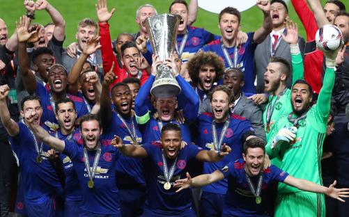 Wayne Rooney of Manchester United lifts the Europa League trophy.