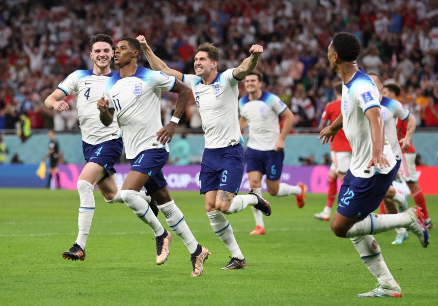 Marcus Rashford of England celebrates after scoring their team's first goal during the FIFA World Cup Qatar 2022 Group B match between Wales and England.