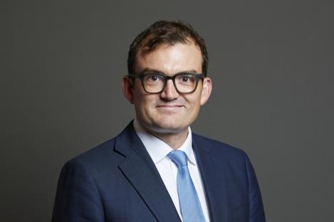 Tory MP charged with sexually assaulting two women at London private members club