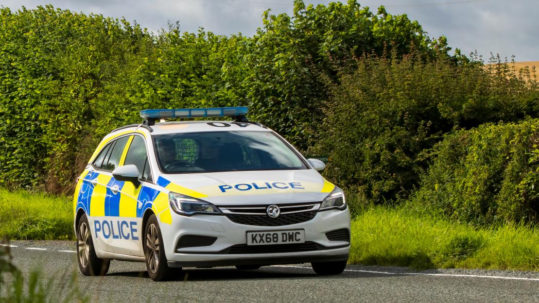 Bedfordshire Police car on a country road.