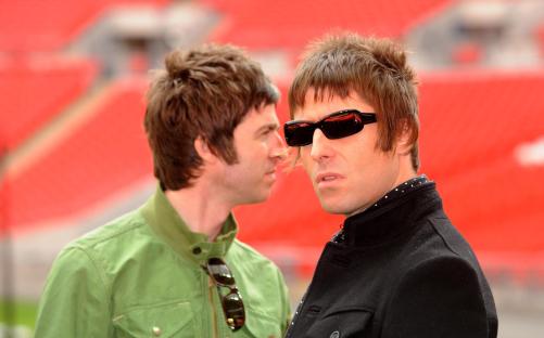 two men wearing sunglasses are standing next to each other