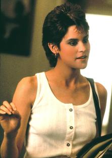 Ally Sheedy in a white tank top.