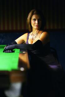 Snooker referee Michaela Tabb at a snooker table.