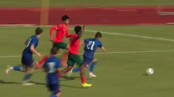 Soccer players vying for the ball.