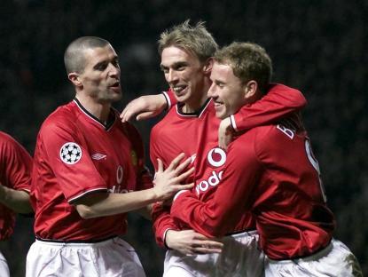 Manchester United players celebrating a goal.