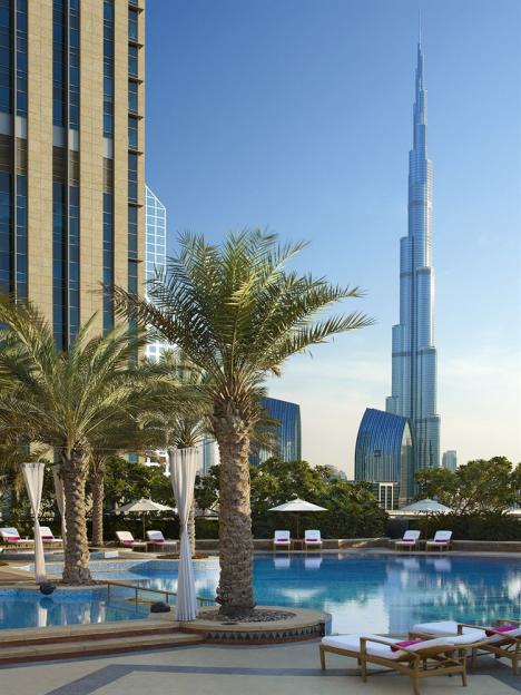 Hotel pool with Burj Khalifa in the background.