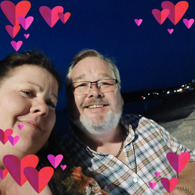Michelle and Christopher Mills posing for a selfie.