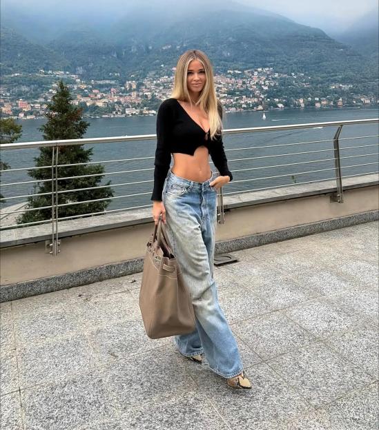 DAZN host Diletta Leotta shows off cleavage in a revealing crop top while on Lake Como.