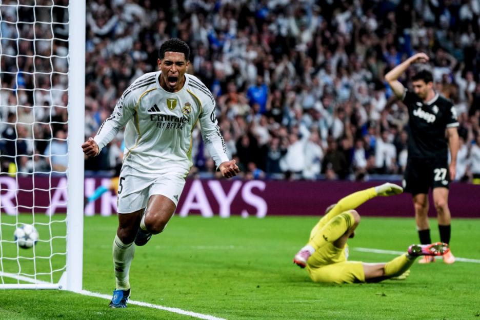 Real Madrid player Jude Bellingham celebrating a goal against Juventus in the UEFA Champions League.