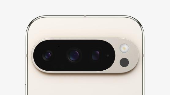 Close-up of a smartphone's triple-lens camera system.
