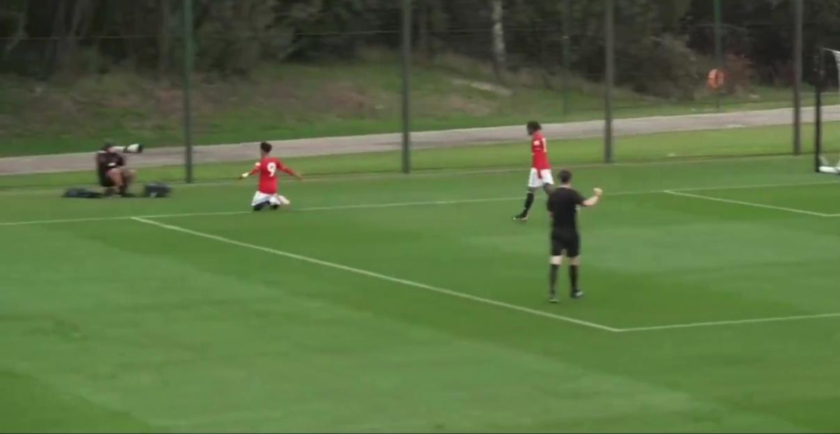 JJ Gabriel on his knees celebrating a goal for Manchester United's U18 team.
